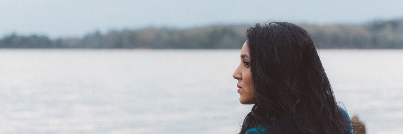 Celebrating My Eating Disorder Recovery Woman looking into the distance by water