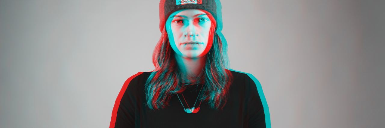 Fighting Mental Health Stigma or Political Advocacy? photo of distorted double exposure woman standing against black background, lined in colour