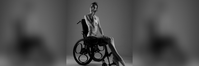 Kate Stanforth modeling, posing in her wheelchair.