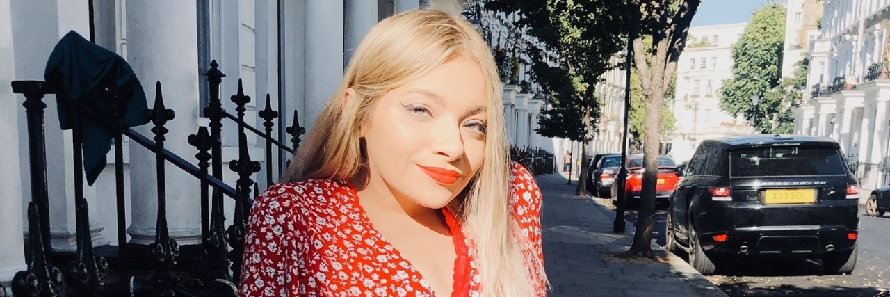 Posting Photos That Show My Scoliosis Full length photo of a young woman in which her spinal curvature is visible.