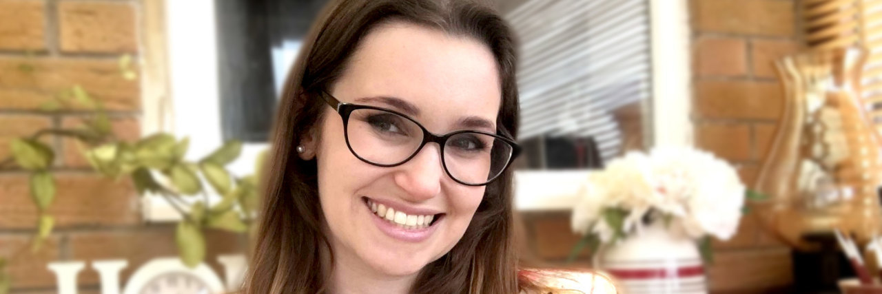 How It Feels to Be Diagnosed With Multiple Sclerosis in My 20s Jessie Ace, a young woman wearing glasses and smiling.