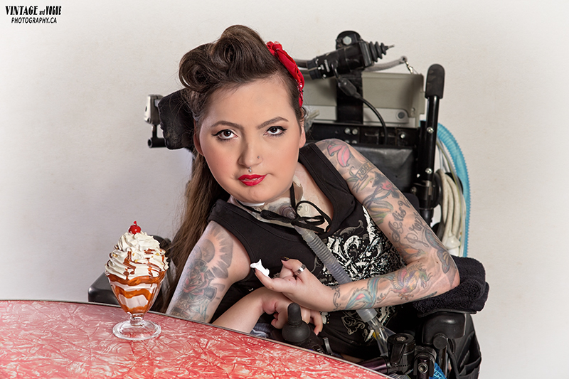 Crystal in pin-up attire, with an ice cream sundae next to her.