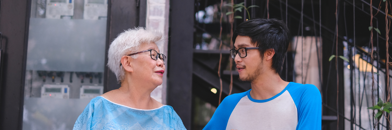 My Grandmother Saying 'I Love You' Made Me Rethink Dying by Suicide grandmother and teenage grandson sitting outside talking to each other