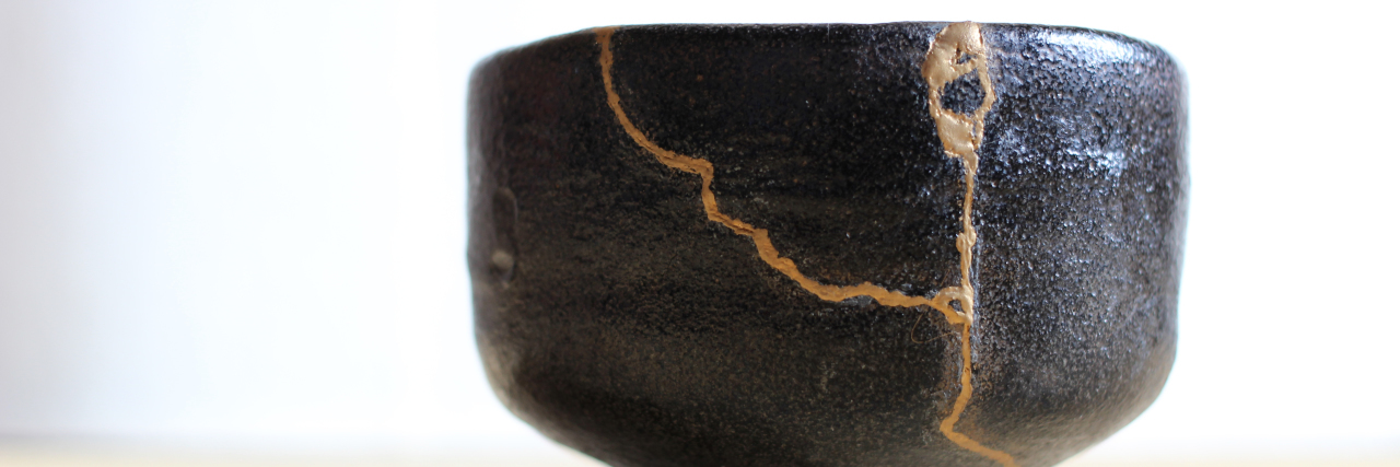 How I'm Using Kintsugi to Accept and Heal My Broken Parts With Bipolar japanese bowl with a crack that has been glued