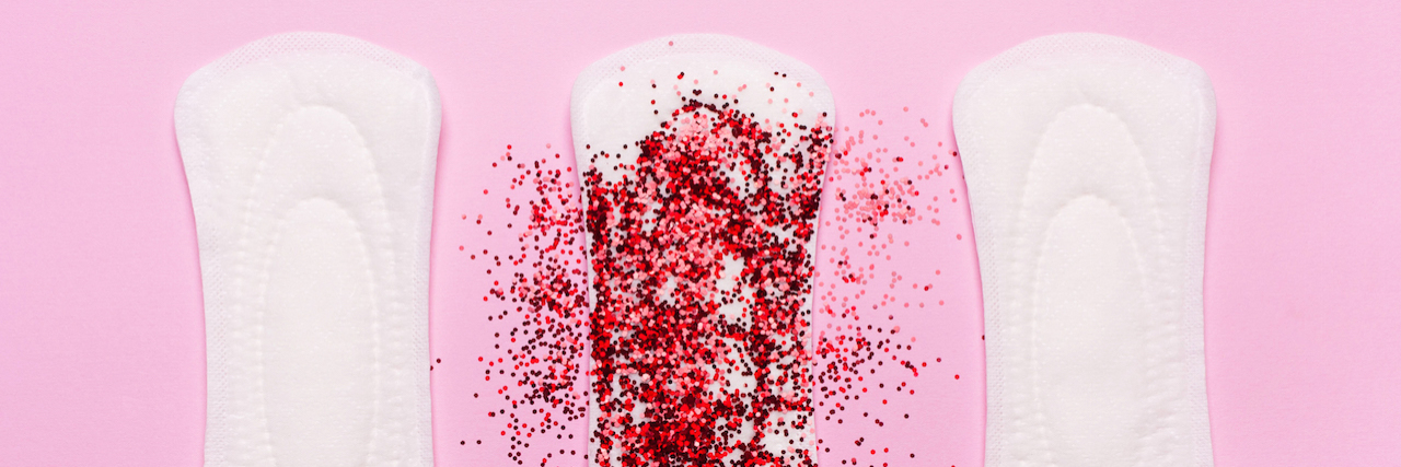 Amenorrhea Caused by Hypothyroidism: Why I Miss My Period Three pads in a row. The middle one is covered in red glitter, representing period blood