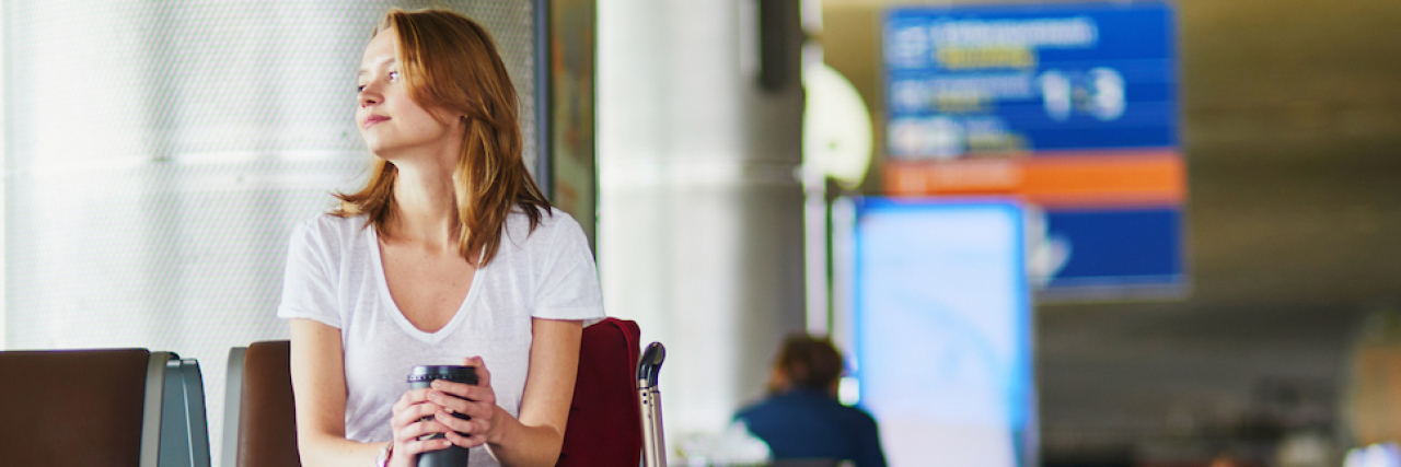I Was Kicked Off a Plane for Having Chronic Ear Infections A woman sitting in an airport