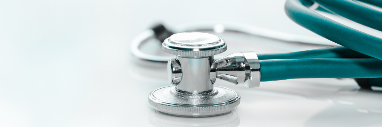 6 Ways to Avoid Medical Gaslighting Stethoscope on a doctor's desk.