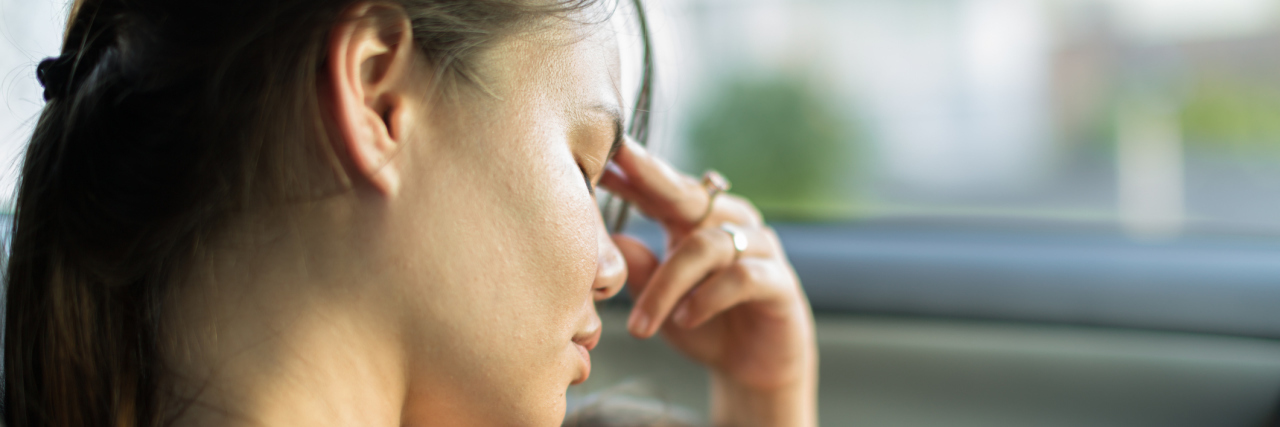 U.S. Senate Votes to Expand Funding for Caregiver Respite Programs A unhappy exhausted mom trying to take a nap with her baby in the car.