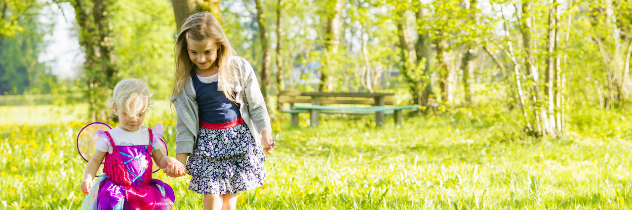 A Letter to My Daughters About Depression and Anxiety Sisters walking together in field