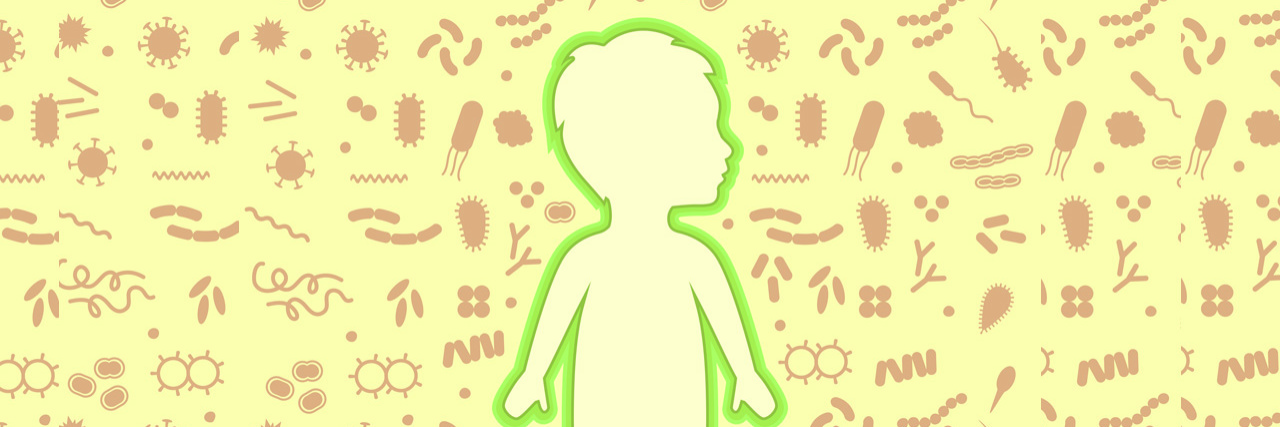 Illustration of a boy standing among illustrations of cells