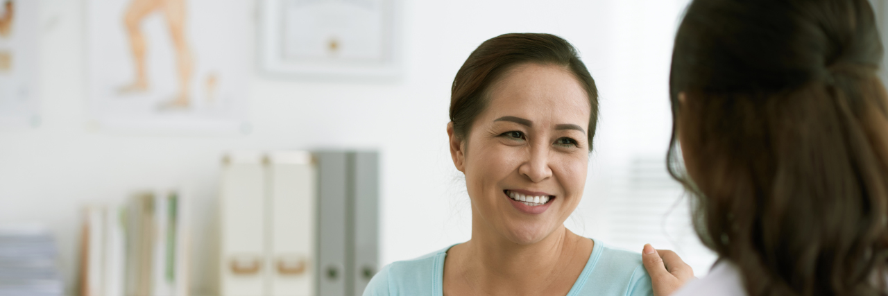 Choosing Doctors When You Live With Chronic Illness Doctor reassuring woman.