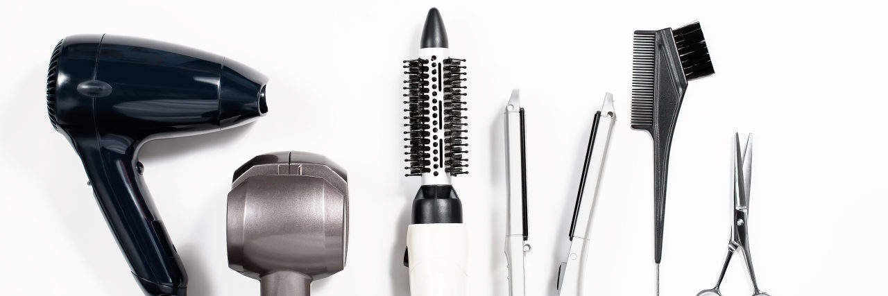 6 Hair and Skin Care Tips for Chronic Illness Warriors Various hair styling tools on white background.