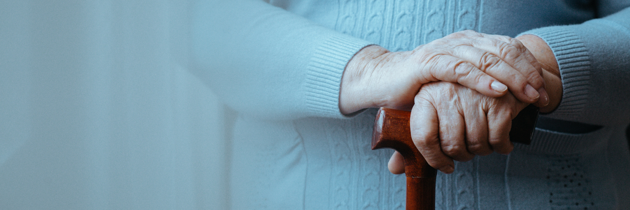 Why I'm Afraid of Aging With a Disability Older lady standing with a wooden walking stick