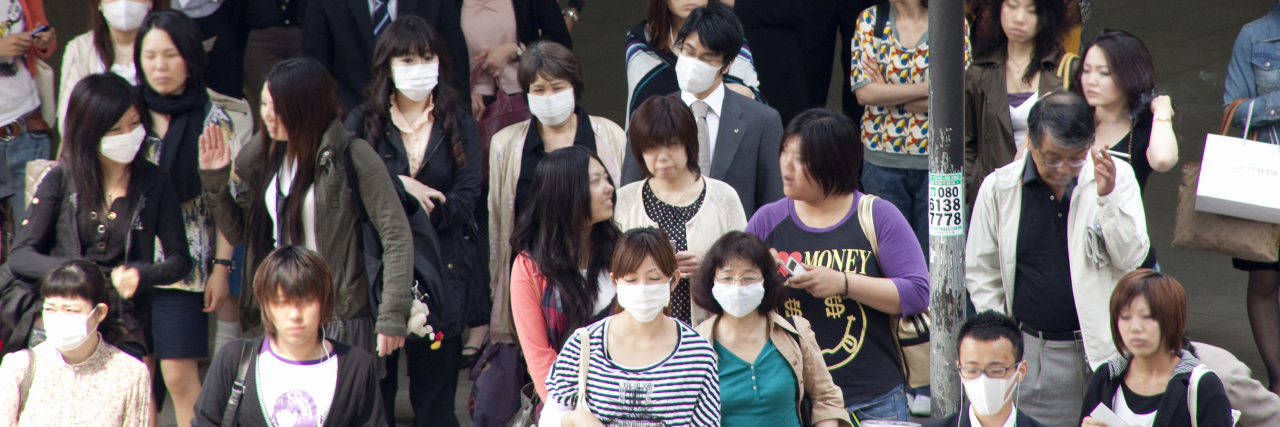 Being Chronically Ill During Japan’s Coronavirus Outbreak People in Japan wearing face masks due to coronavirus.