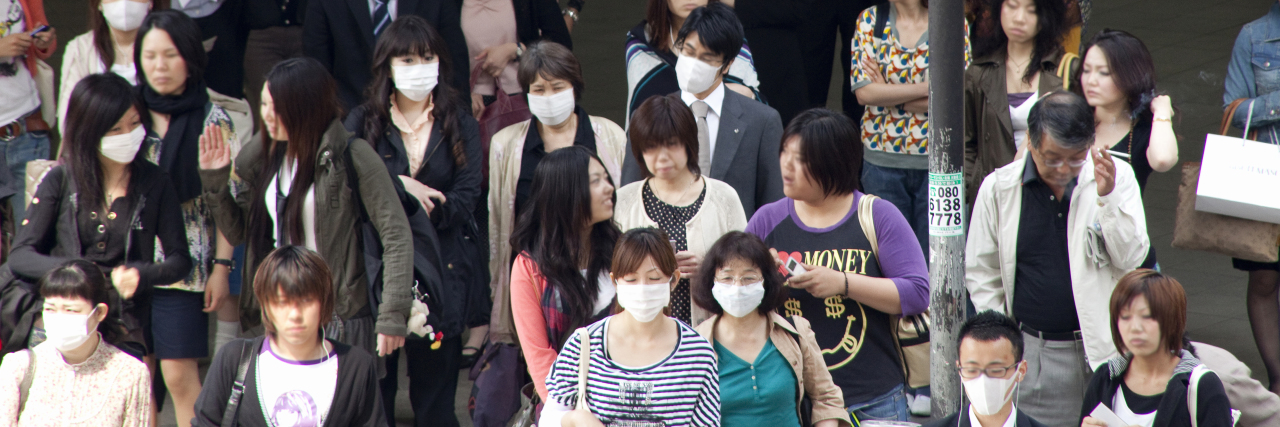 People in Japan wearing face masks due to coronavirus.