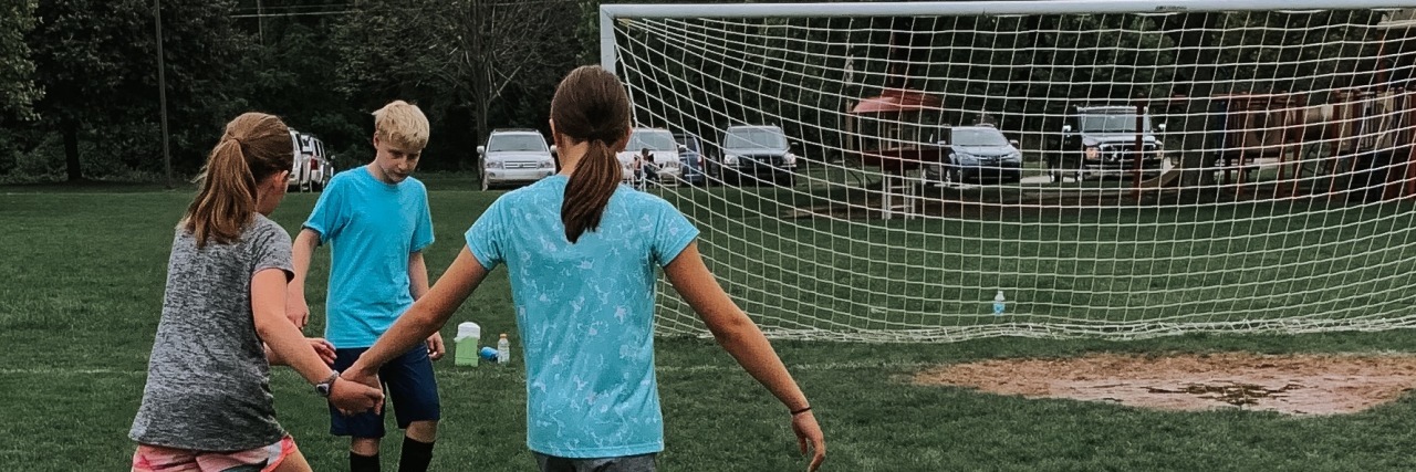 How Unified Sports Is Furthering Disability Inclusion Students playing inclusive sports.