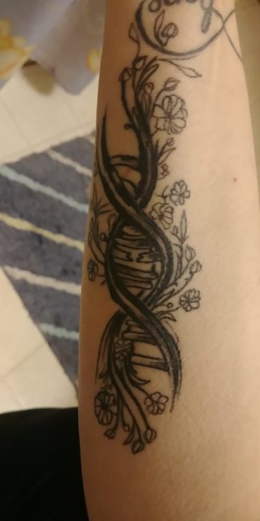 tattoo of DNA rung, part of it broken