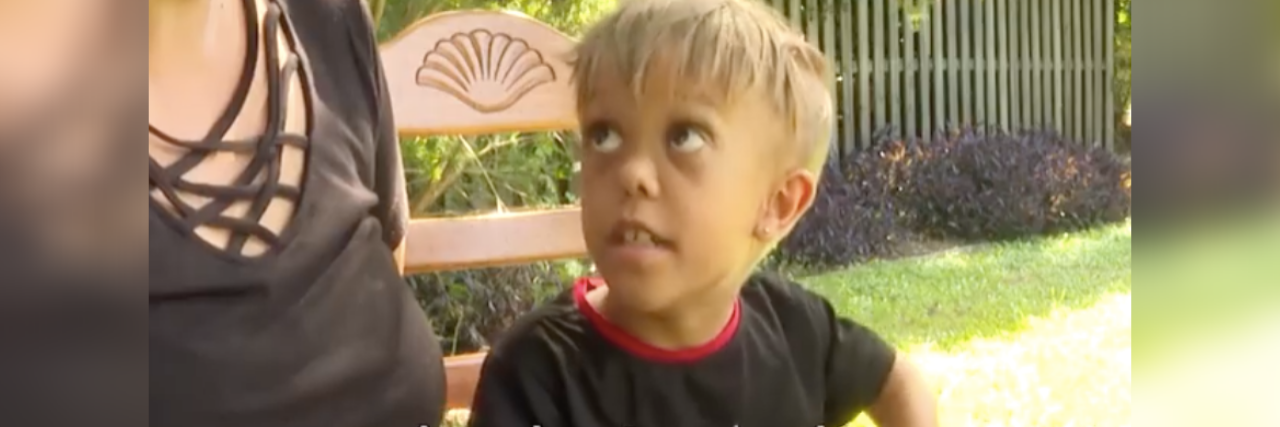 How to Protect Disabled Children Like Quaden Bayles From Bullies Quaden Bayles and his mom sitting on a bench