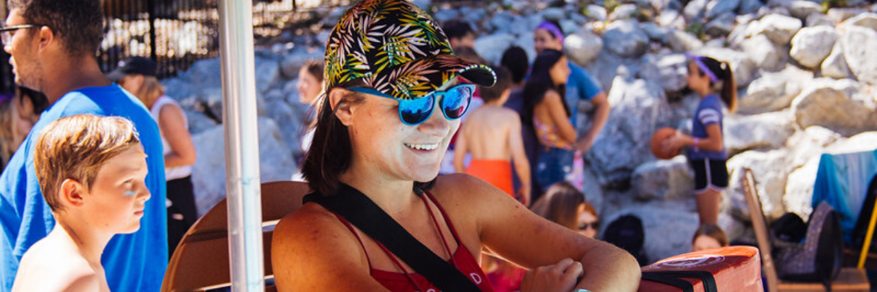 Why ADHD Didn't Stop Me From Becoming a Lifeguard a lifeguard sitting on her post