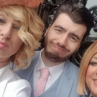selfie of author with brother and mother, all dressed up