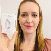 photo of contributor holding a box for the moodbeam one mood tracker