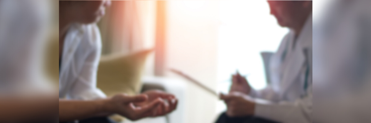 Coping With the Ongoing Trauma of Living With Chronic Illness Doctor and patient in session