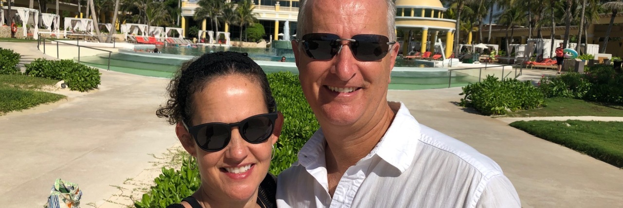 Building a Strong Marriage With Multiple Sclerosis Christie and her husband outdoors, smiling.