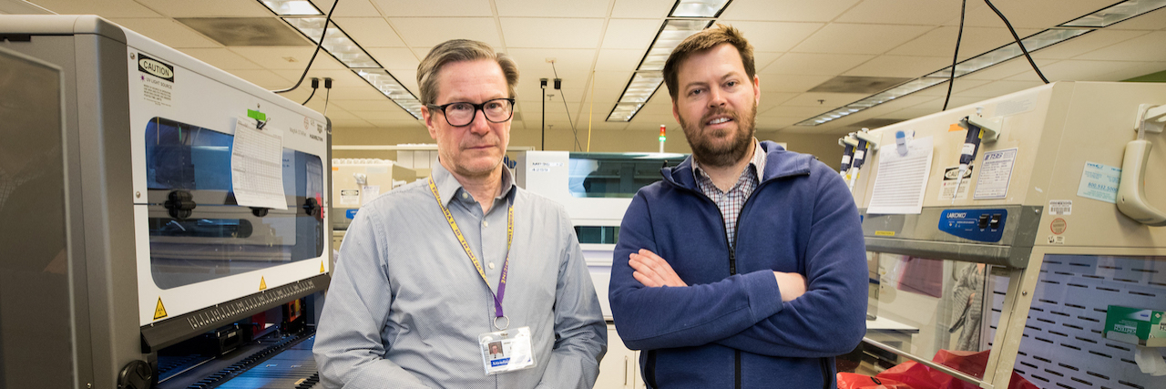 Dr. Keith Jerome (left), director of the UW Medicine Virology laboratory in Seattle, and Dr. Alex Greninger, assistant director of the lab, quickly ramped up a test to detect the novel coronavirus, SARS-CoV-2. As of March 11, their lab had performed nearly 3,000 tests ― with nearly 270 found to be positive. They were photographed at the lab on March 11, 2020. (Dan DeLong for KHN)