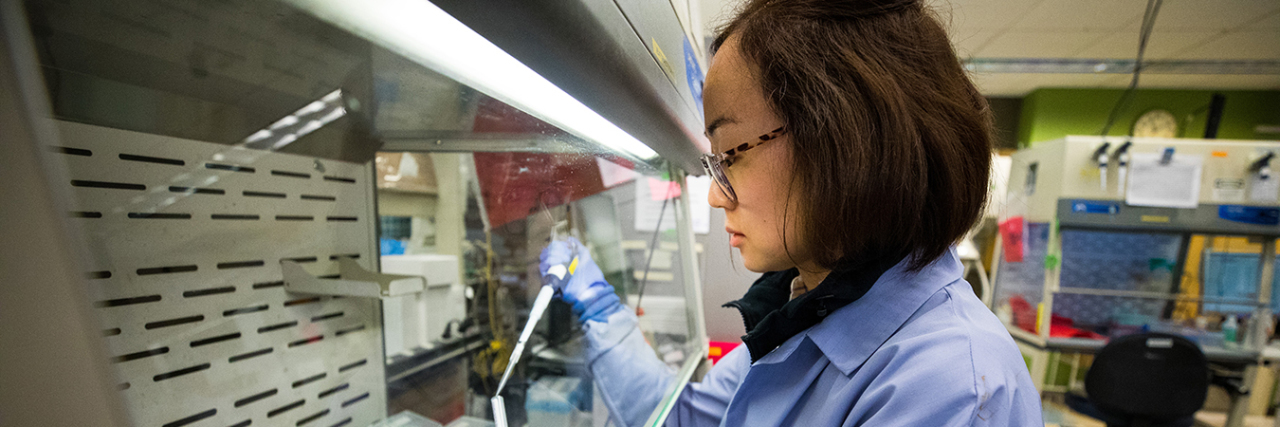 States Reporting Incomplete COVID-19 Results Mask Viral Spread A medical laboratory scientist at the UW Medicine Virology laboratory in Seattle reviews samples of purified genetic material to detect COVID-19 cases on March 11, 2020. (Dan DeLong for KHN)