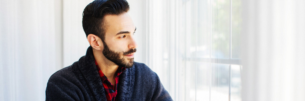 COVID-19 Pandemic: What Is Ambiguous Loss? The author looking out a window