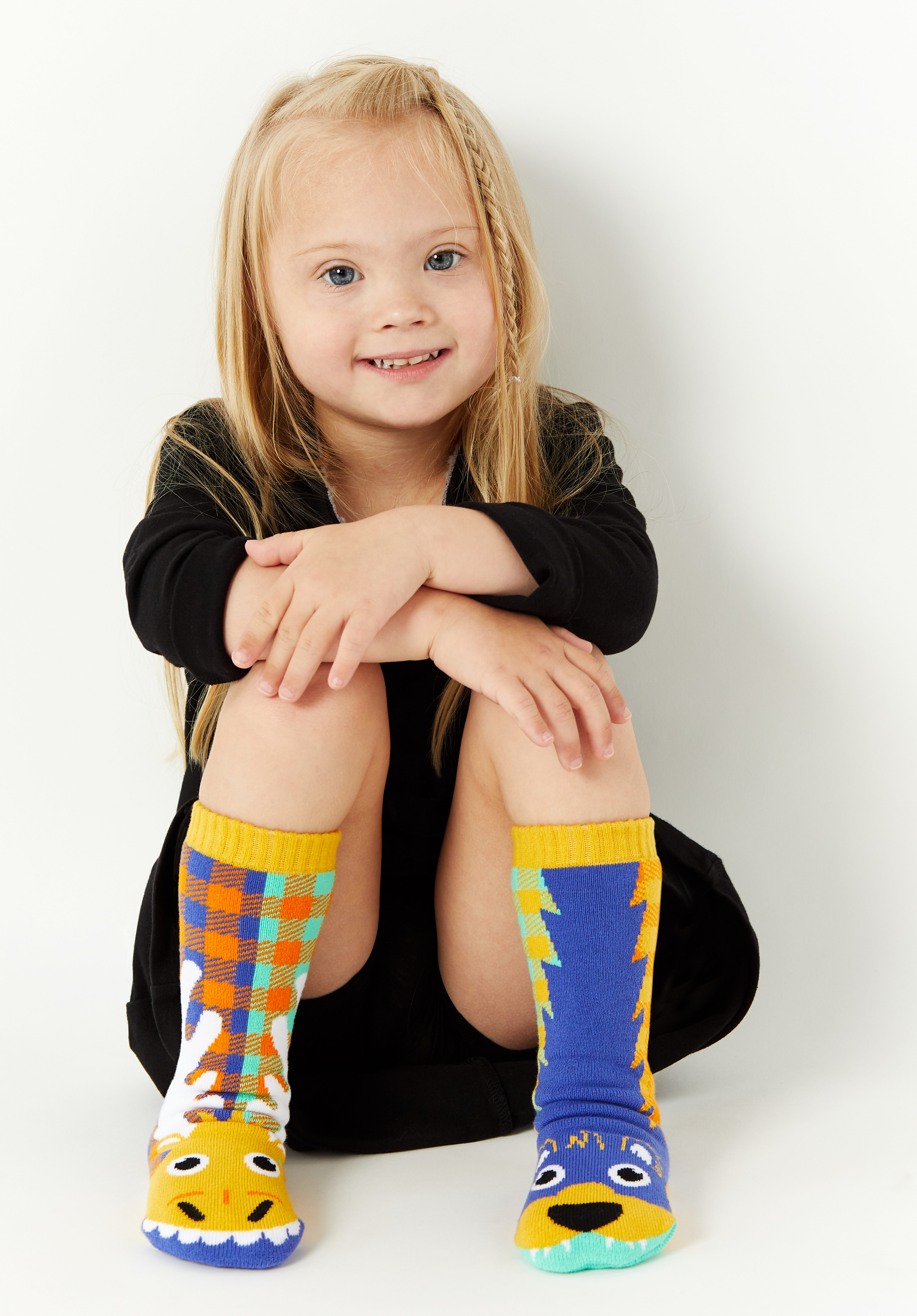 Farah's daughter wearing colorful socks.