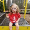 Kimberly's daughter who has trisomy 18 on the playground. She is medically fragile and in danger due to the COVID-19 coronavirus.