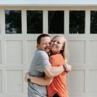 Erin hugging her brother who has Down syndrome.