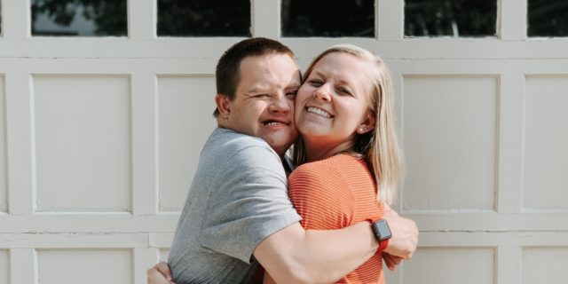 Why the R-Word Is Still a Problem Erin hugging her brother who has Down syndrome.
