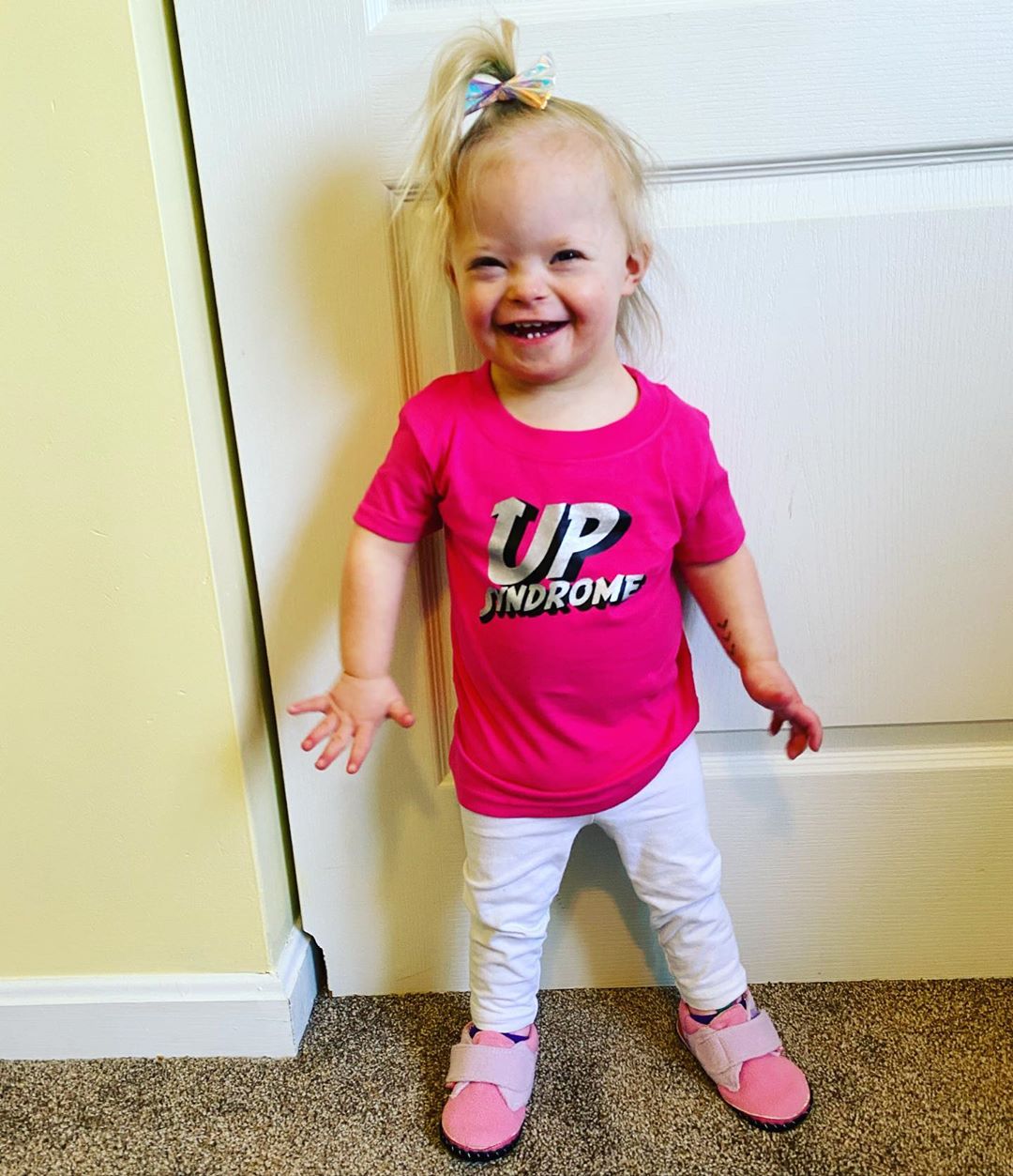 Alice wearing a pink t-shirt that says "Up Syndrome."