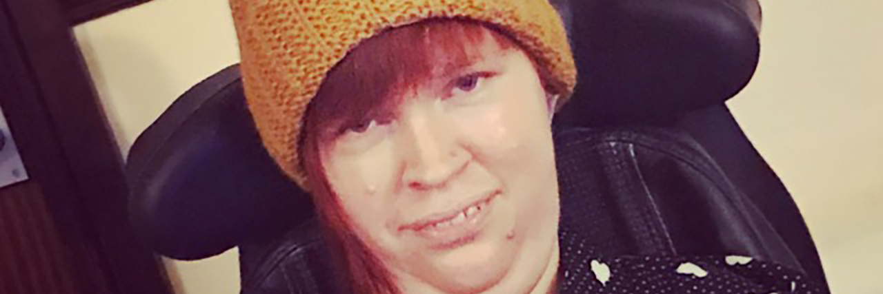 12 Frustrations of Being a Wheelchair User Gemma wearing an orange hat.