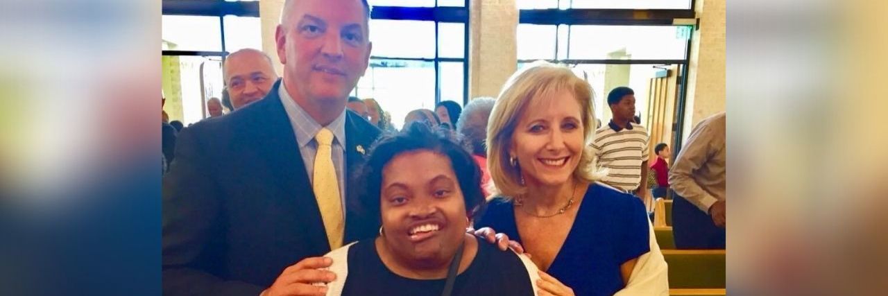 Louisiana Disability Advocate April Dunn Dies at 33 Due to COVID-19 Louisiana Governer John Bel Edwards and his wife Donna with disability advocate April Dunn (center)