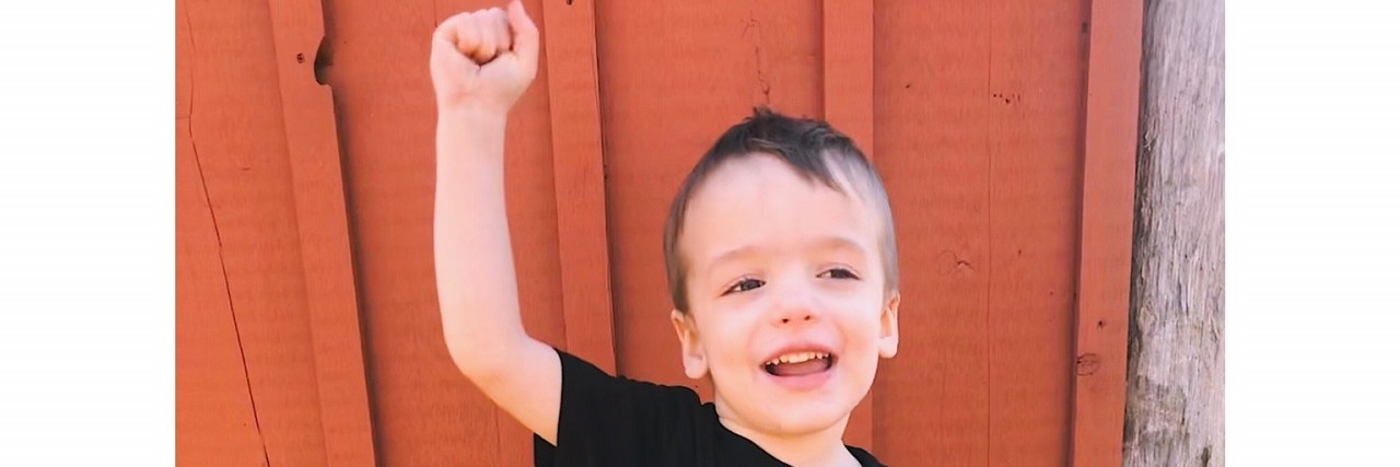 My Child With Cerebral Palsy Doesn't Need to Be 'Fixed' Flynn with his hands in the air, ready to raise CP Awareness!