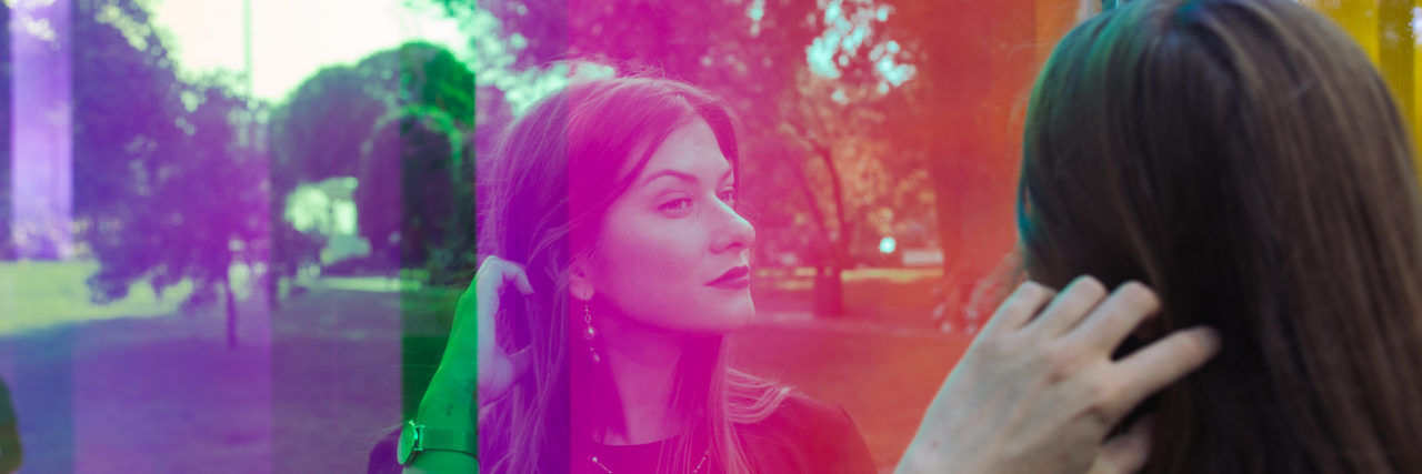 When Social-Distancing Is Triggering Due to Your Medical History Portrait of a woman looking in a reflection