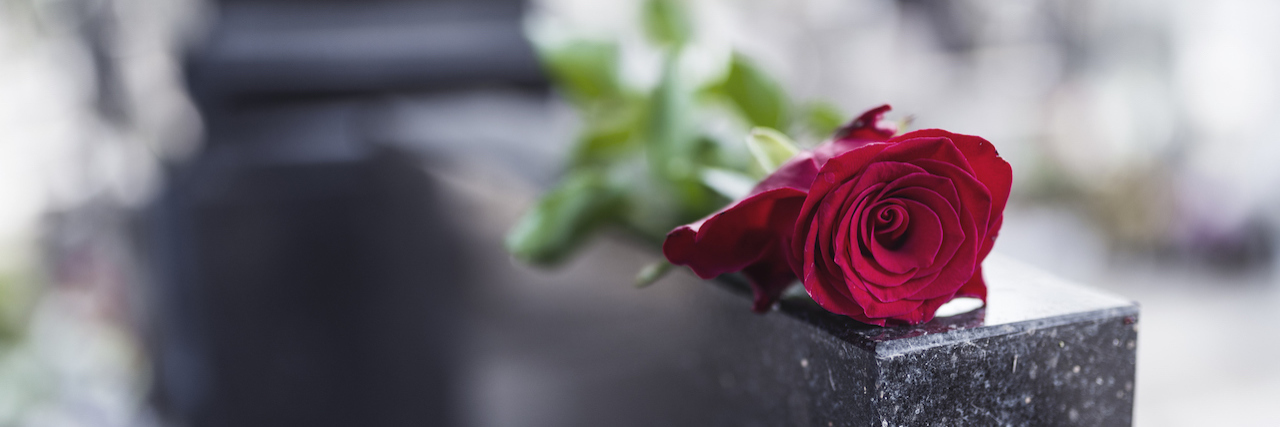 Funeral Homes, Families Ponder Deaths in the Age of COVID-19 Rose on tombstone. Red rose on grave. Love - loss. Flower on memorial stone close up. Tragedy and sorrow for the loss of a loved one. Memory. Gravestone with withered rose (Rose on tombstone. Red rose on grave. Love - loss. Flower on memorial stone cl