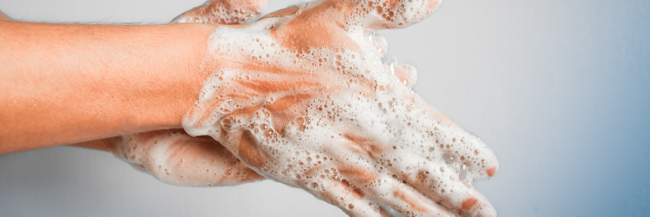 A Doctor Shares What You Should Do to Prevent COVID-19 Woman washing hands.