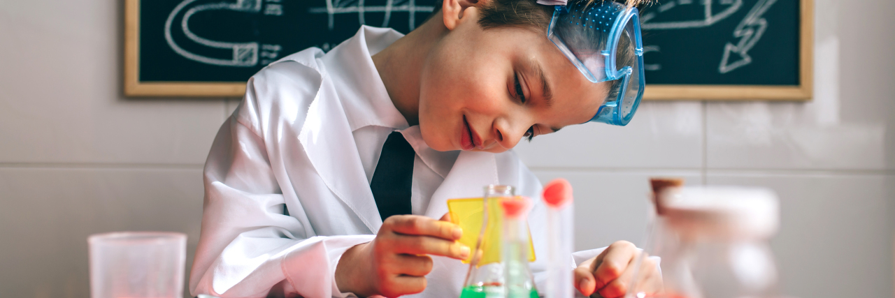 Why You Shouldn't Use the Word 'Functioning' to Describe Autism Boy playing with chemistry set.