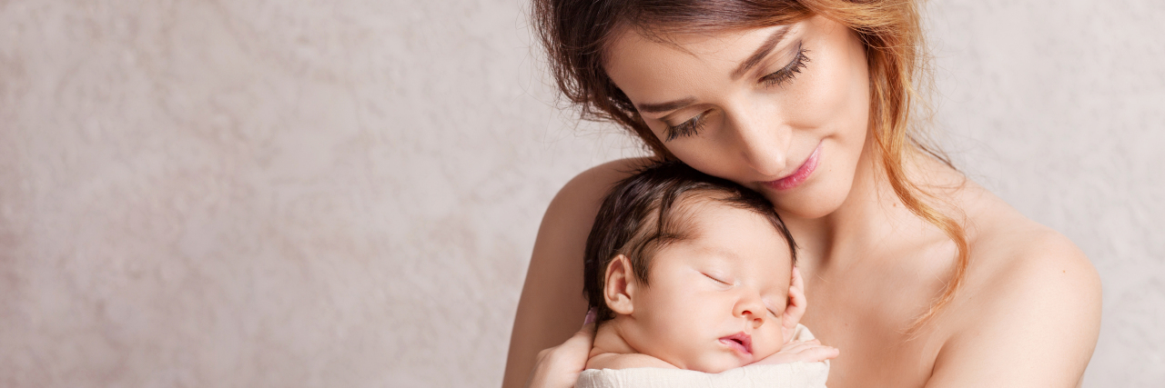 Advice for New Moms of Children With Spina Bifida Mother holding baby.