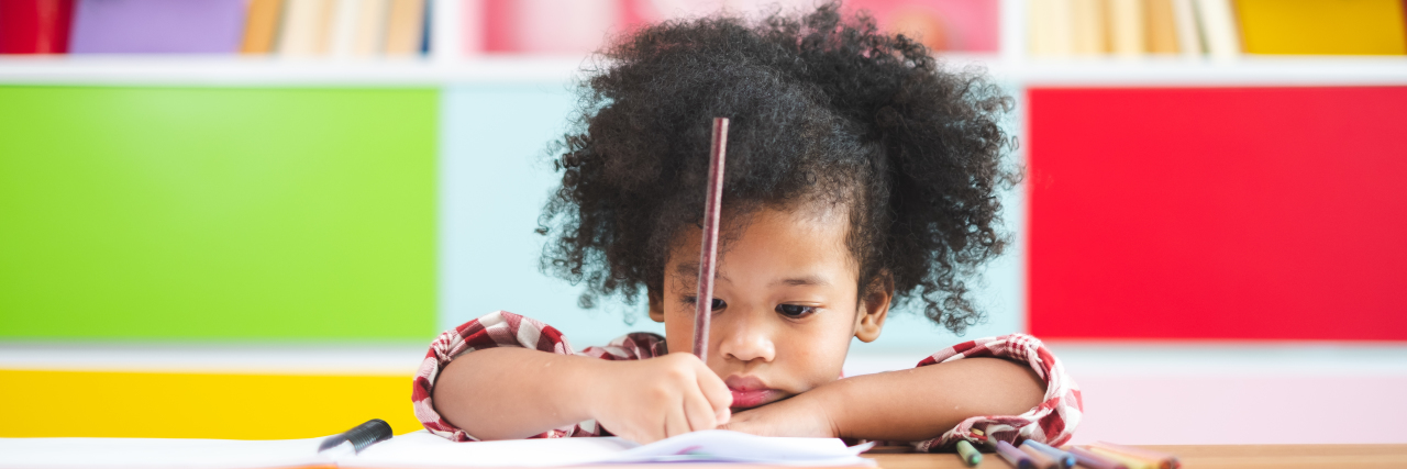 African-American girl studying at home.