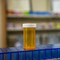 Empty medical pill bottle in pharmacy