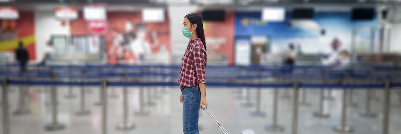 Coronavirus and Chronic Illness: What You Need to Know Asian tourist with luggage ,wearing mask to prevent during travel time at the airport terminal for protect from the new Coronavirus 2019 infection outbreak situation