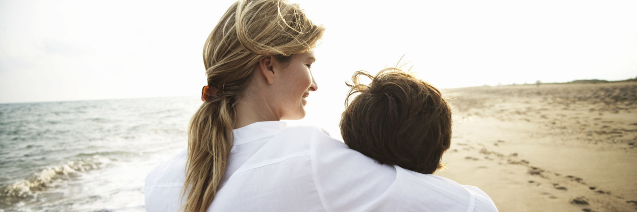 The Word 'Normal' Changed When My Son and I Were Diagnosed With OCD mother and son walking on beach, mother's arm around son