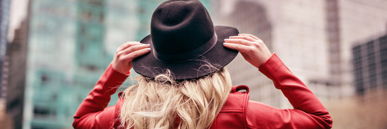 These Photos Show Some of the Strange Ways Skin Cancer Can Hide Back view of woman wearing hat