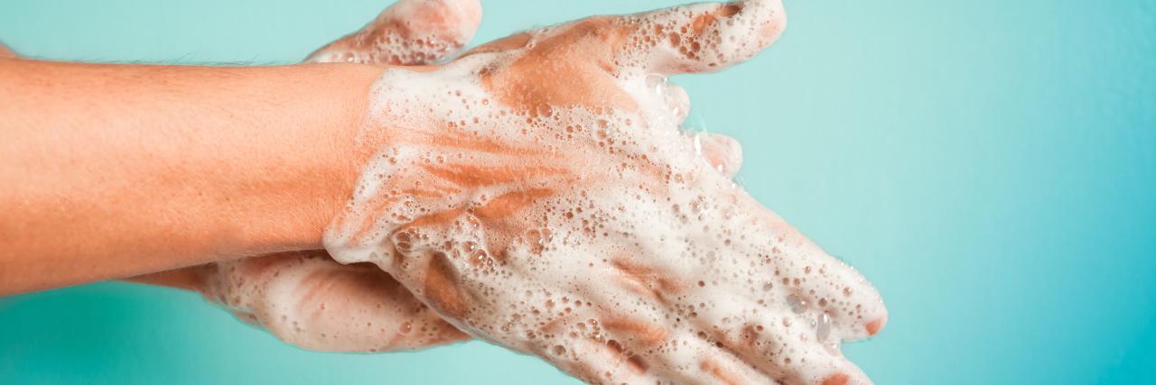 What to Do If COVID-19 Health Guidelines Are Triggering Anxiety/OCD closeup of person washing hands