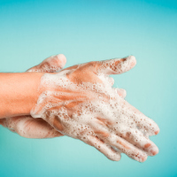 closeup of person washing hands